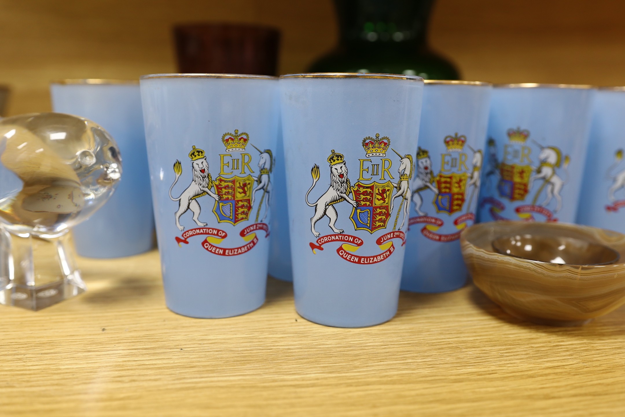 An assortment of twenty-four Coronation glasses in celebration of Queen Elizabeth II, together with other glassware and items to include a Baccarat model of a bird